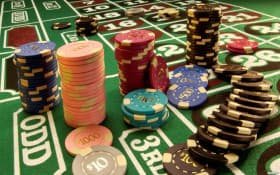 Playtech blackjack table with dealer, cards, and player interface